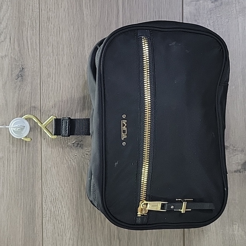 Tumi Black Cosmetic Bag with Gold Accents